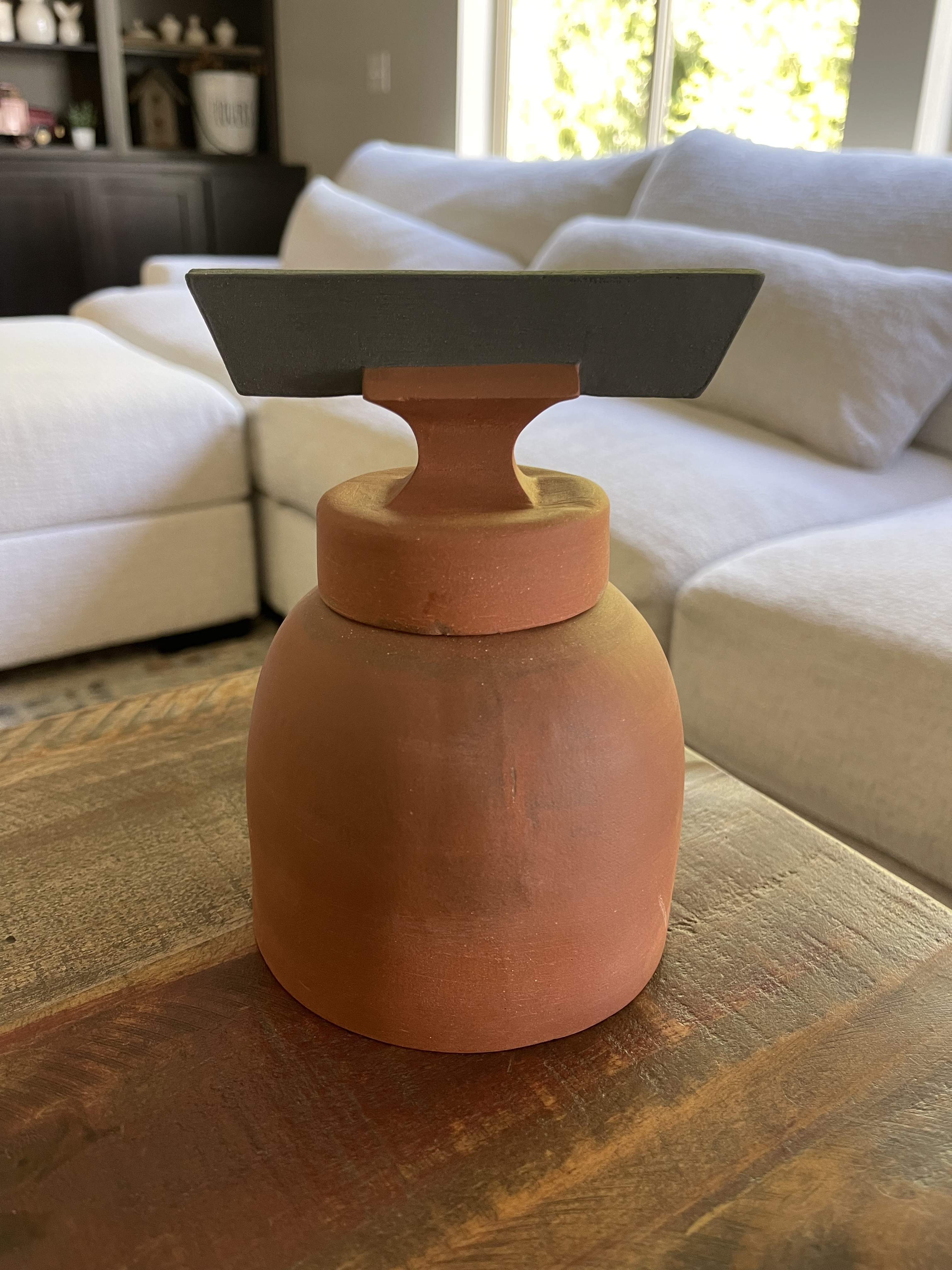 Jar I, a terracotta jar with a black handle