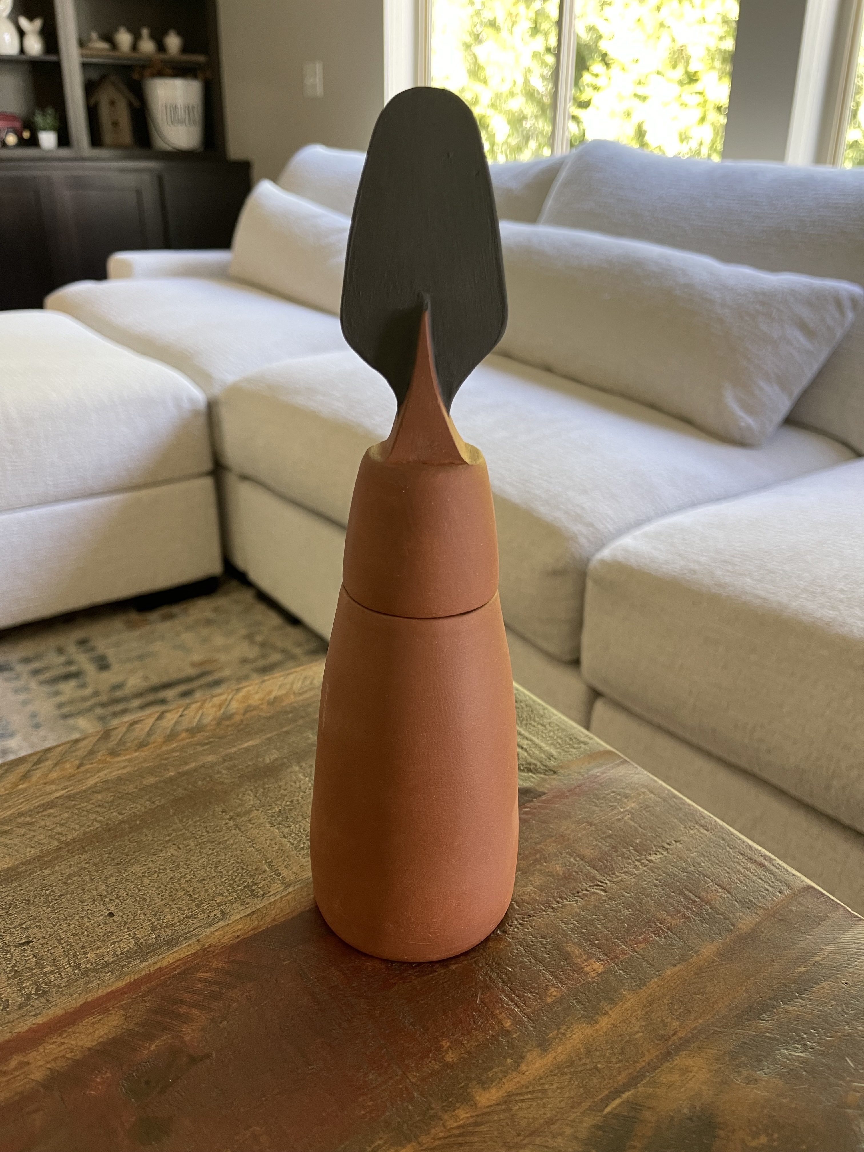 Jar II, a terracotta jar with a black handle