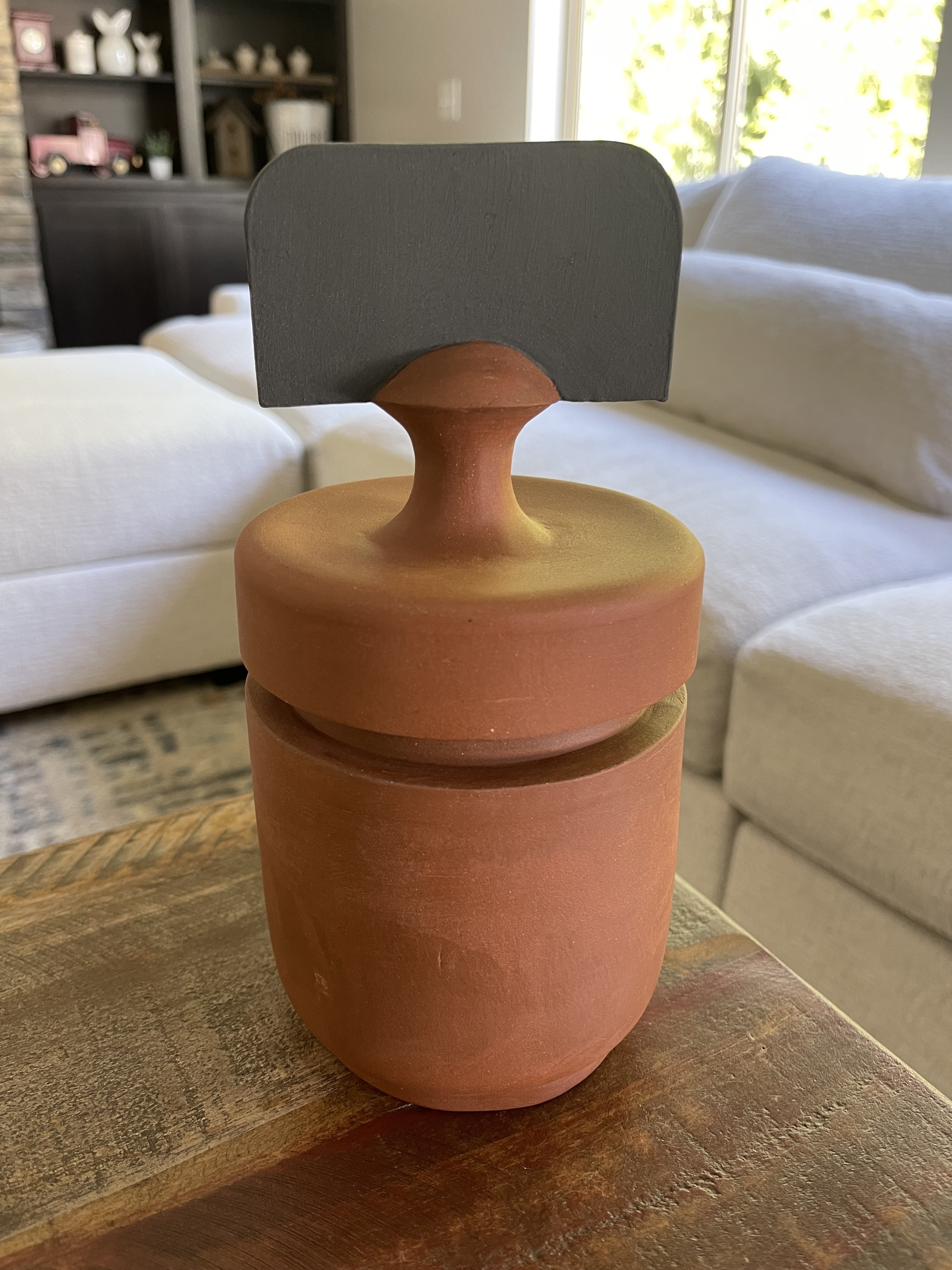 Jar III, a terracotta jar with a black handle