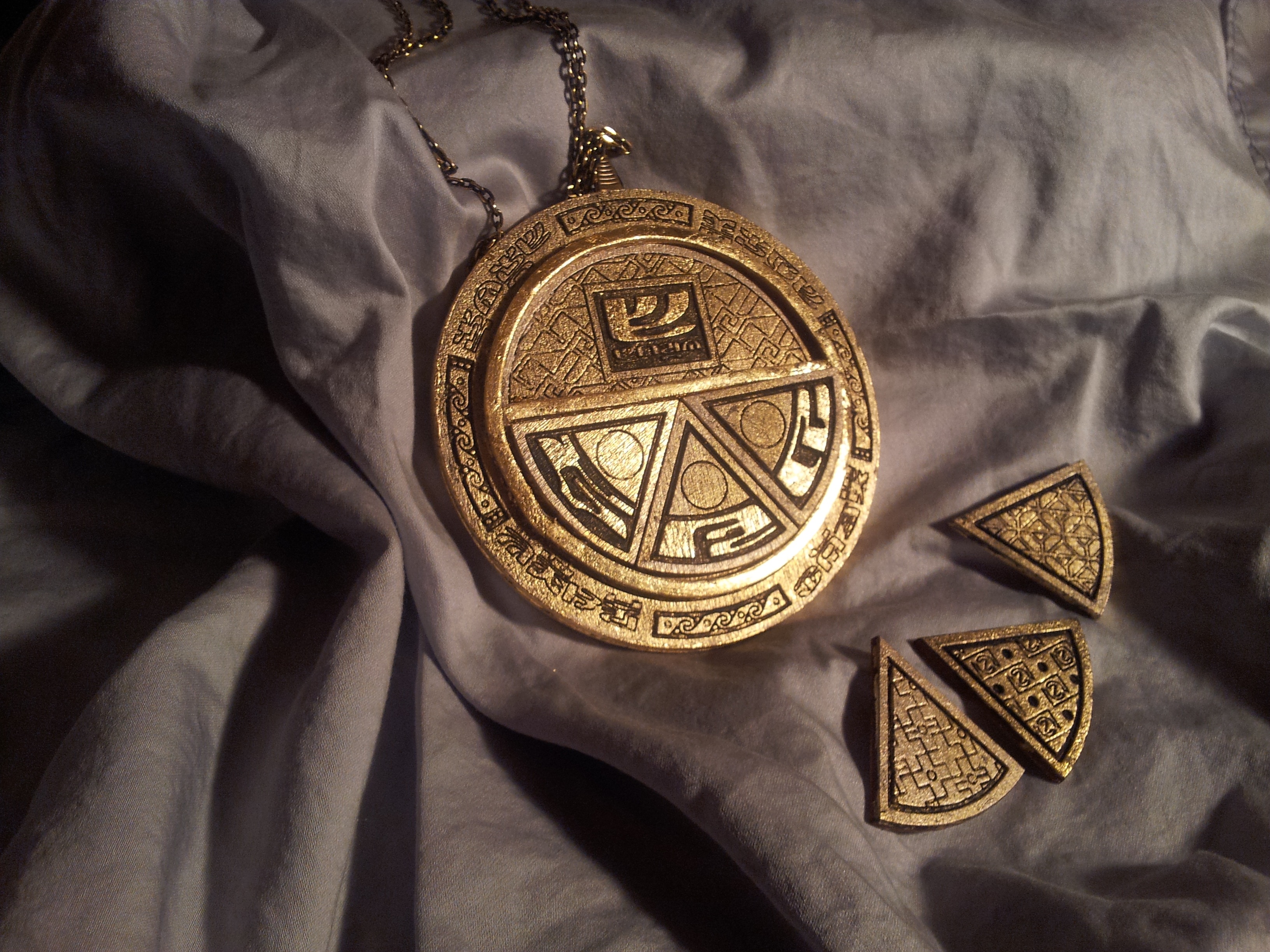 Ornamental medallion with geometric designs and accompanying decorative components