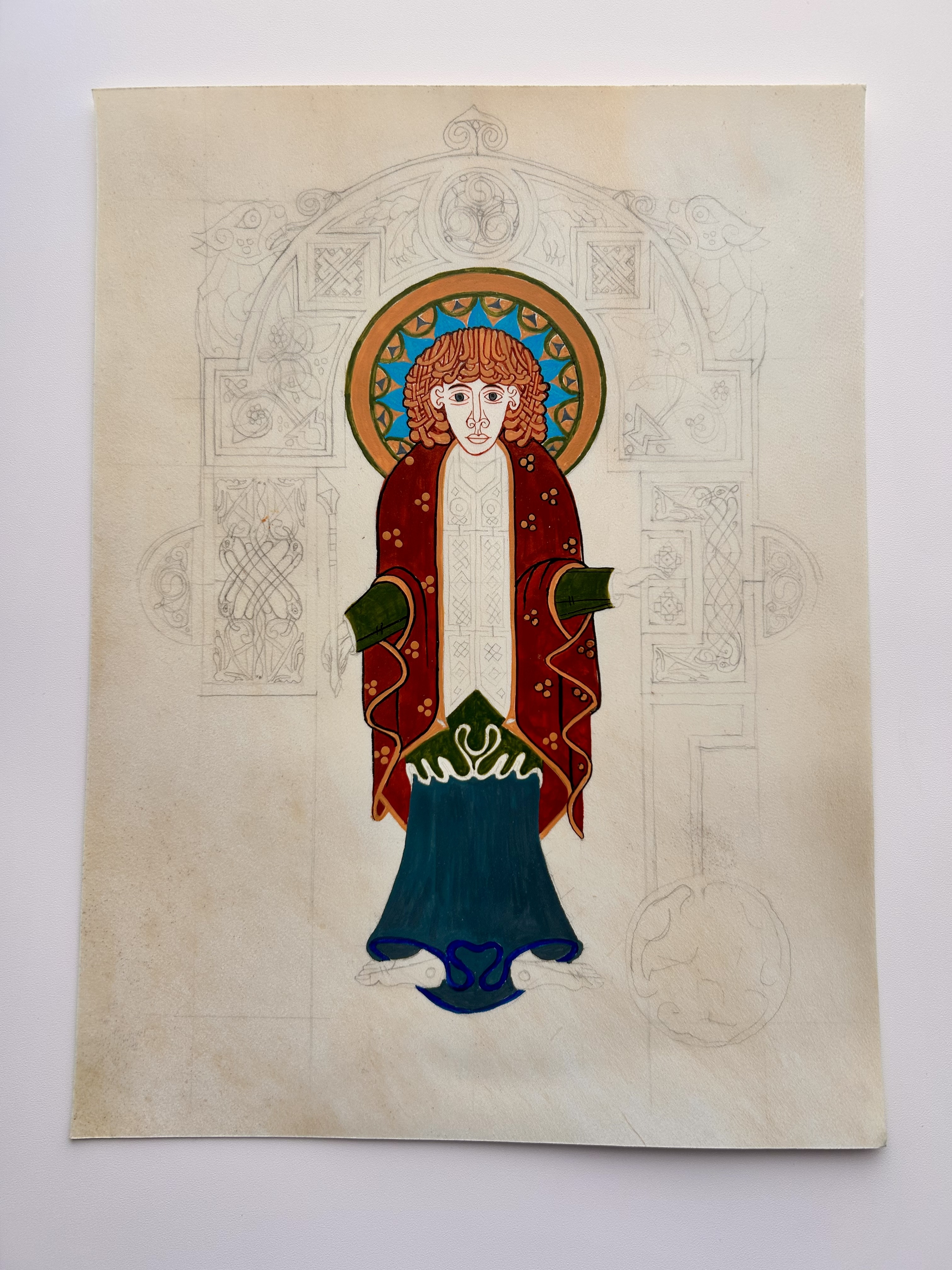 Illuminated standing figure with colored garments and unfinished architectural ornament