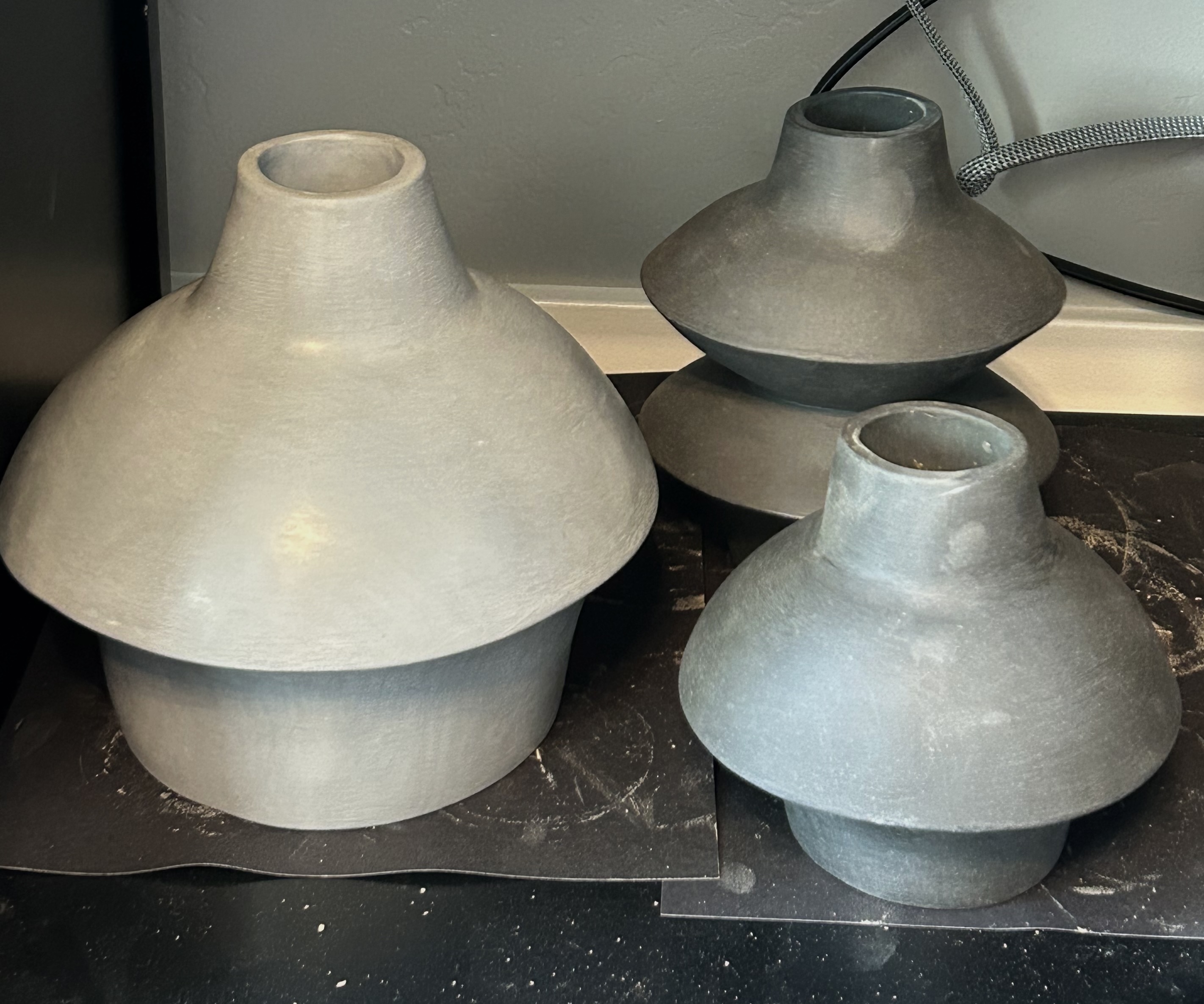 Undecorated ceramic jug forms in the workshop